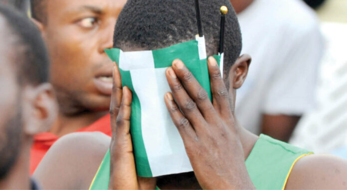 A-Nigerian-football-fan-reacts-after-a-poor-performance-by-the-Super-Eagles