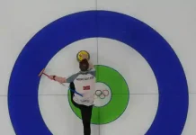 Winter Olympics begin quietly with curling