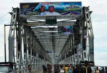 Umahi Reopens First Niger Bridge as Tinubu’s Campaign Billboards Feature Prominently